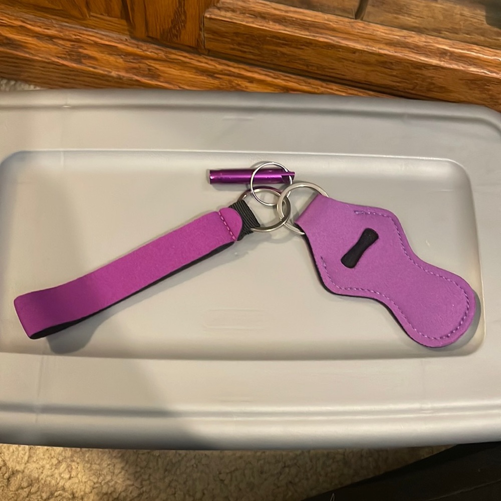 Chapstick holder with safety whistle